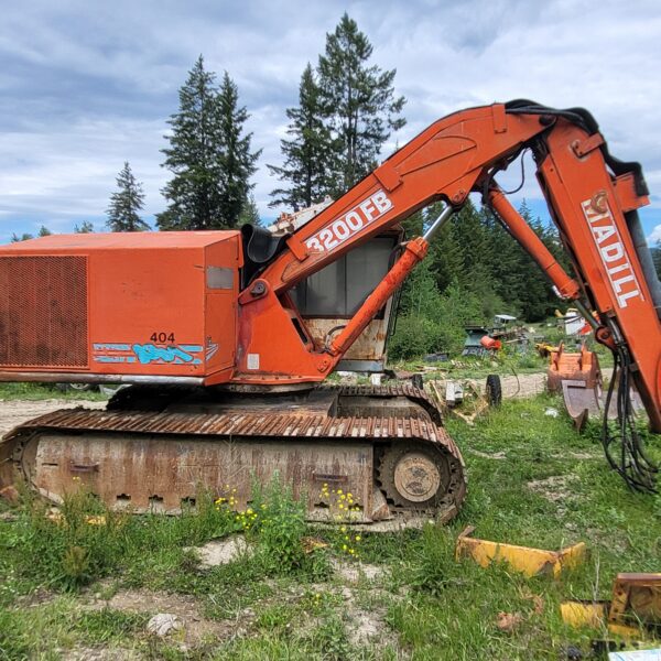 Madill 3200 Buncher with Quadco Full Rotating Head